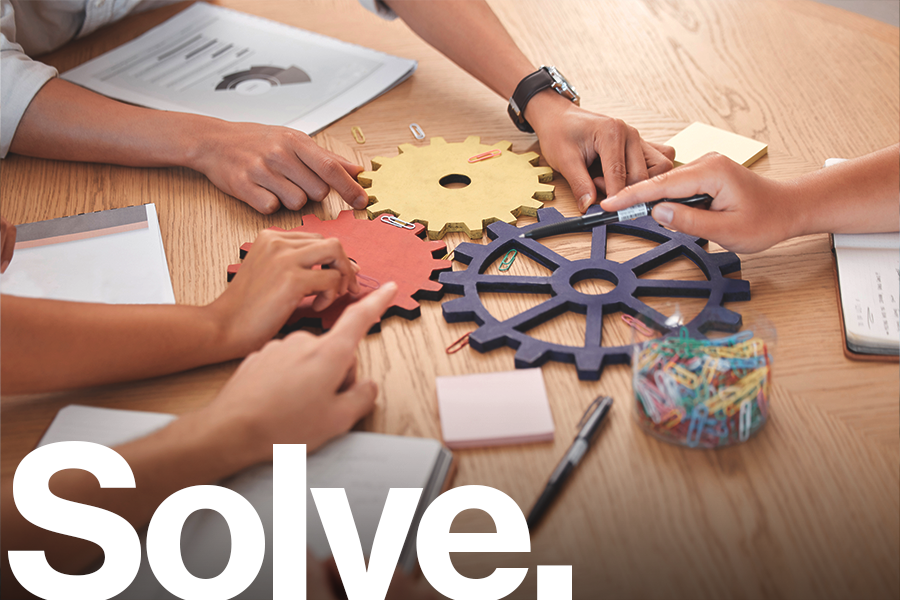 Solve: A diverse group fit various gears into place.