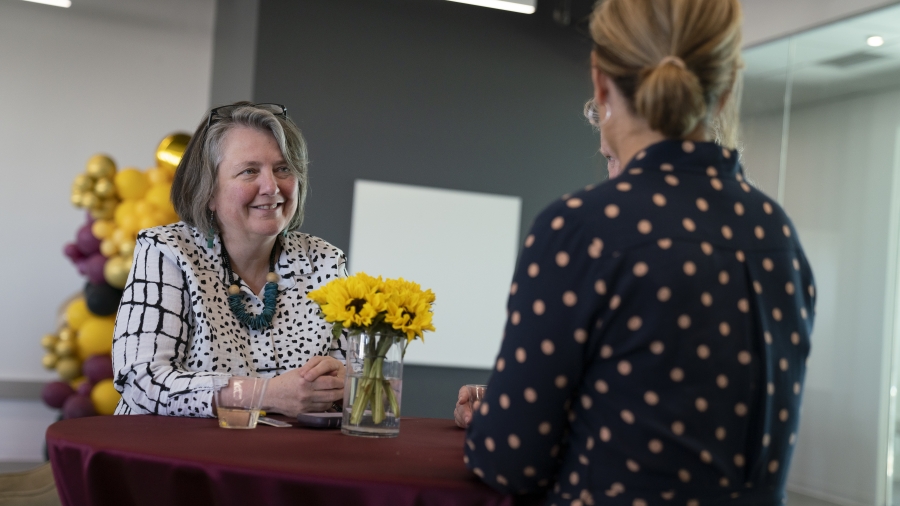 Kathleen Merrigan, executive director of the Swette Center for Sustainable Food Systems, chats with Miki Kittilson, vice dean of the College of Global Futures.