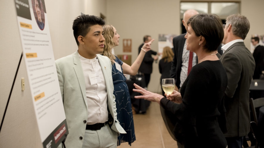 2019 Resilience Fellow Adonias Arevalo discussing his project with Celebration guests