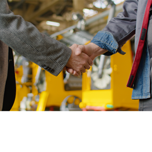 handshake between academic and factory worker