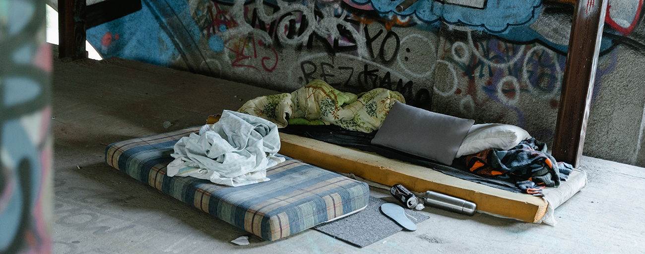 Care coordination for improved outcomes for unsheltered