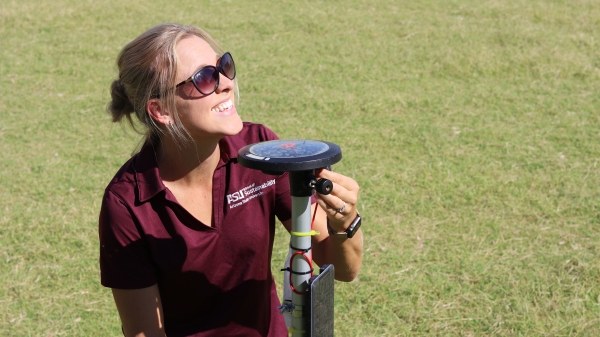 Jenni with a weather station 