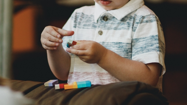 child playing with toy 