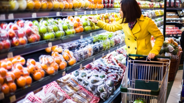 A woman grocery shopping