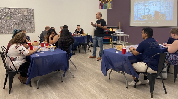 Augie Gastelum leading a community meeting to map neighborhood resources