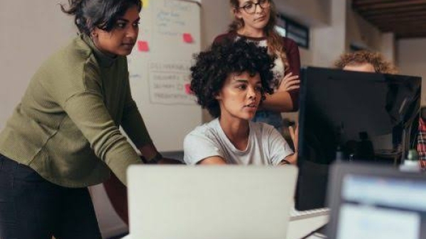 Women collaborate at work