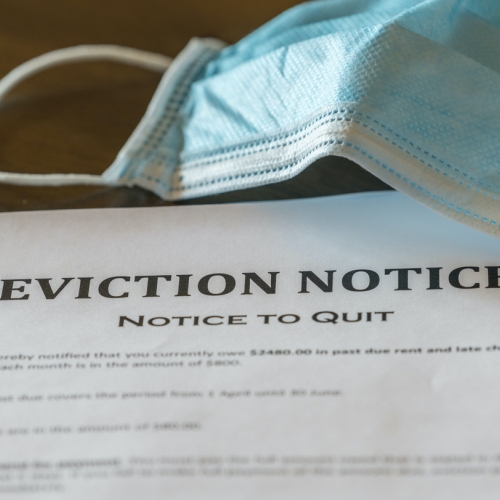 Evictions notice and face mask on a table